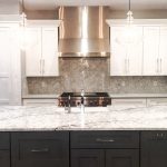 quartz countertops and white cabinets in a kitchen