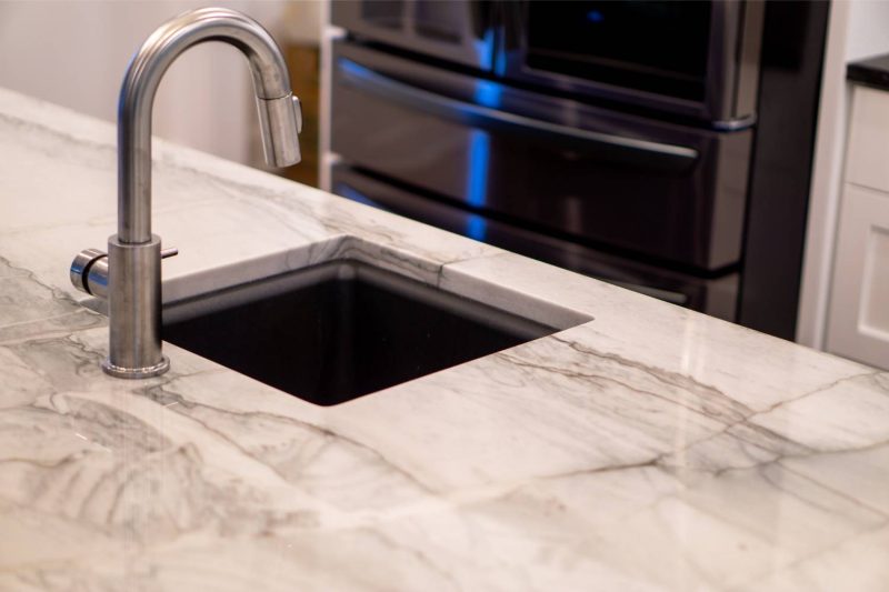 Kitchen faucet on granite countertop Indianapolis | Peak Stone Company